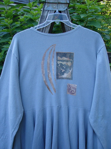 Alt text: 1994 Reprocessed Dance Dress Moon Fish Solstice Blue OSFA with whimsical moon fish design, long sleeves, and a swingy lower hem.