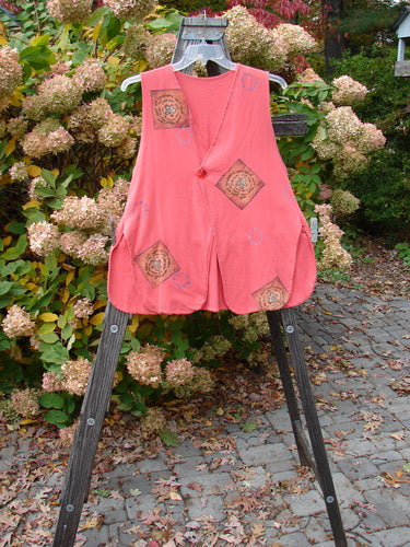 1997 Elements Dock Vest Ocean Life Altered Firefly Altered Size 1: Pink vest on wooden stand, featuring a single button closure, signature patch, high vented rounded sides, draw cord back, and ocean life theme paint. Bust 42, Waist 44, Hips 48, Length 28.