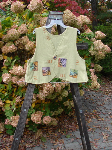 1997 Troubadour Vest with Abstract Fish Gal Theme, Blue Fish Patch, and Porcelain Button on a Wooden Ladder