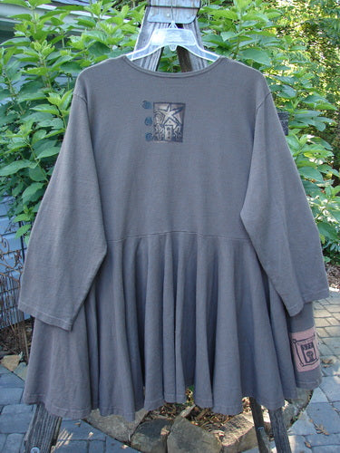 Alt text: 1994 Reprocessed Dance Dress Belief Spirit Magic Humus OSFA displayed on a hanger, featuring a weighted thick cotton knit with a swingy lower, drop waist, and long sleeves.