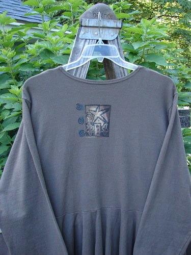 Alt text: 1994 Reprocessed Dance Dress Belief Spirit Magic Humus OSFA on a hanger, featuring long cozy sleeves and a super swingy lower, displayed in perfect condition.