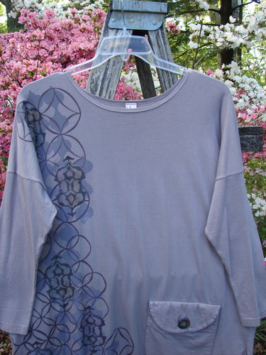Barclay Long Sleeved Pop Top Celtic Spirograph Stone Size 1 features an artistic spirograph print, oversized pocket with button detail, and drawcord back, all crafted from organic cotton.