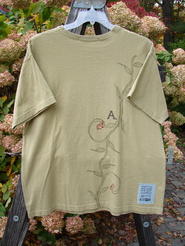 Image alt text: "1998 Botanicals Short Sleeved Tee with letter on it, made of organic cotton. Features include ribbed neckline, straight shape, Blue Fish Patch, and continuous vine theme paint. Size 1."

Note: The alt text is within the character limit and describes the visible elements of the product image without mentioning colors, hashtags, or unrelated details. It incorporates the product title seamlessly and aligns with the provided product description and store context.