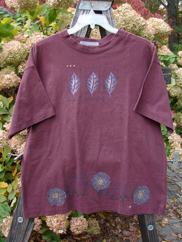1997 Short Sleeved Tee with Triple Leaf design on a purple fabric. Made from Organic Cotton. Perfect Condition. Size 1.
