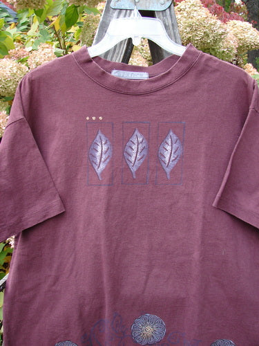 1997 Short Sleeved Tee with Triple Leaf design. Purple shirt with leaves on it. Made from Organic Cotton. Perfect Condition. Size 1.