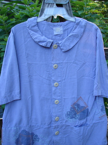 2000 Tencel Camp Shirt Airmail Twilight Size 0 displayed on a hanger, showcasing its Peter Pan collar, oversized buttons, front drop pocket, lower widening seam, and full paneled sweep.