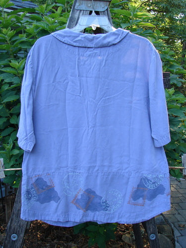 2000 Tencel Camp Shirt Airmail Twilight Size 0 on a hanger, featuring a Peter Pan collar, oversized buttons, front drop pocket, and airmail theme.