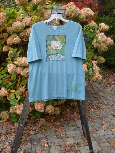 2000 Artist Choice Short Sleeved Tee with teapot theme paint on blue shirt