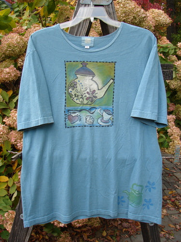 2000 Artist Choice Tee with teapot and teacups design on blue fabric