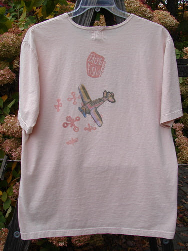 2001 Short Sleeved Tee Airplane Pink Tile Size 0: A white shirt with a picture of a plane.