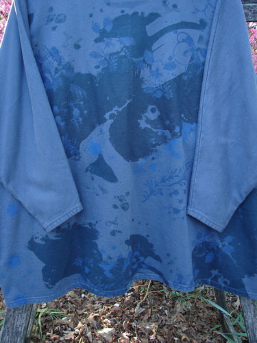 Barclay Fleece Big Square Pullover Botanical Path Night Navy OSFA displayed on a wooden bench, showcasing its abstract floral-vine pattern, dolman shoulders, and square A-line shape, embodying Bluefishfinder.com's vintage essence.