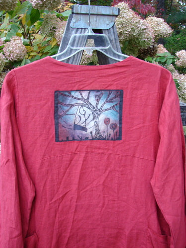 Image alt text: Barclay Linen Tidal Jacket with Home Swing Paint, Geisha's Robe, altered size 0. Red shirt with picture of a tree, wooden object close-up.