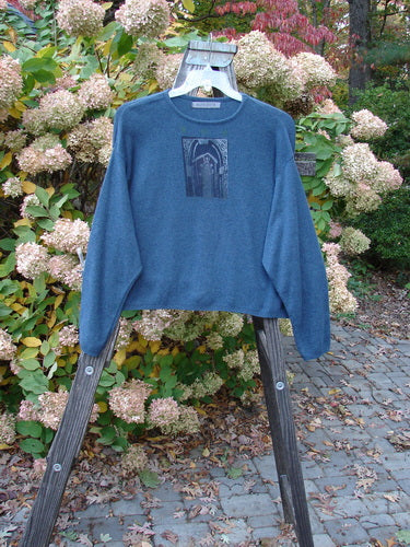 1997 Cashmere Long Sleeved Crop Pullover with a blue sweater on a swinger, showcasing a gate theme paint.