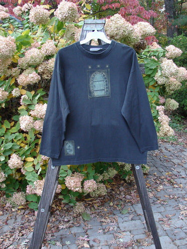 Image alt text: 1997 Long Sleeved Tee Stone Door Cast Iron Size 1 - A long sleeved shirt with a stone door theme paint, made from mid-weight organic cotton.