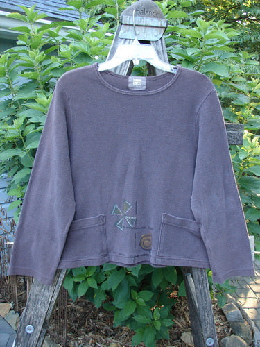 1999 Thermal Boatneck Pullover Chick Currant Size 0 displayed on a mannequin, showcasing its long sleeves, A-line shape, and two front billowy pockets. The pullover has a cropped, boxy fit.