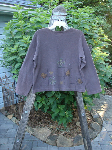 1999 Thermal Boatneck Pullover Chick Currant Size 0 displayed on a wooden rack, showcasing its A-line shape, two front billowy pockets, and thermal fabric, highlighting its unique vintage charm.