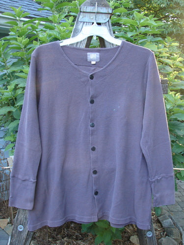 2000 Thermal Lu Top Unpainted Eggplant Size 1 on a hanger, featuring ribbed cuffs, rubberized buttons, and a slight A-line shape with lightweight, stretchy ribbed texture.