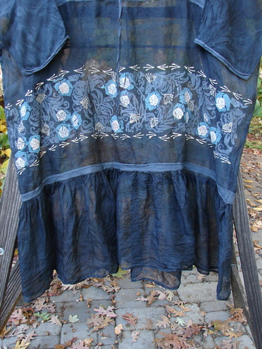A blue dress with a drawcord gather front, full ruffled lower, and garden patch theme paint. Barclay Silk Empire Sash Dress Garden Patch Black Size 2.