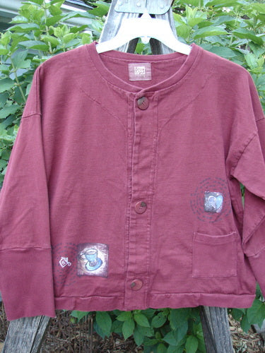 1999 Cottage Cardigan Heart Cup Cinnamon Size 0 with patches, ribbed lower sleeves, and oversized buttons, showcasing a unique boxy shape and textured fabric, adorned with Blue Fish signature heart cup theme.