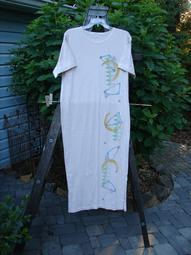 1996 Long Tee Dress Half Moon Birch Bark Size 0, organic cotton, short wide sleeves, seamless front and back, longer straighter shape, signature blue fish patch, displayed on a clothesline.