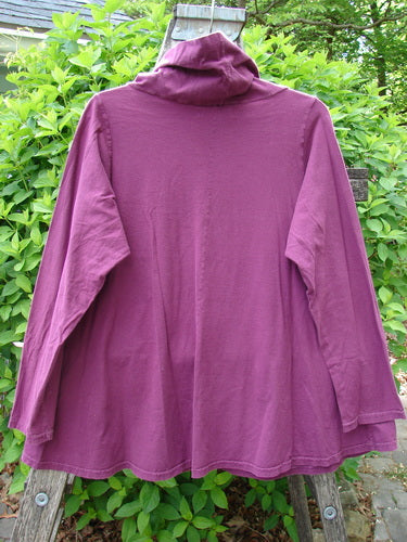 Barclay Cowl Neck Long Sleeved A Line Top Rock Note Merlot Size 0 draped over a wooden ladder, showcasing its floppy double-layered cowl neckline and sweet curly edgings against a natural backdrop.