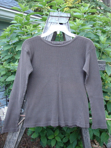 1998 Pointelle Long Sleeved Undertop Top Unpainted Stick Size 1 on clothes rack, showcasing soft rib knit pattern, cozy long sleeves, and a rolled neckline. Perfect for layering with Blue Fish pieces.