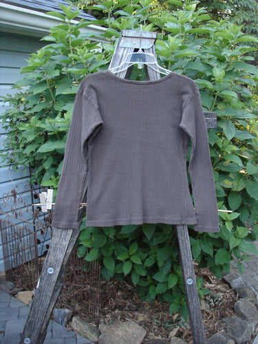 1998 Pointelle Long Sleeved Undertop Top Unpainted Stick Size 1 on a wooden rack, showcasing its soft rib-knit pointelle pattern, rolled neckline, and cozy, slightly longer sleeves.