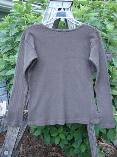 1998 Pointelle Long Sleeved Undertop Top Unpainted Stick Size 1 displayed on a clothes rack, showcasing its soft rib knit pointelle pattern, cozy long sleeves, and rolled neckline.