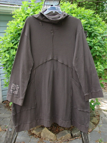 Barclay Patched Thermal Cowl Neck Reverse Stitch Pocket Pullover Bark Size 0 features exposed seams, a cozy cowl neck, and a patch on the sleeve, displayed outdoors on a hanger.