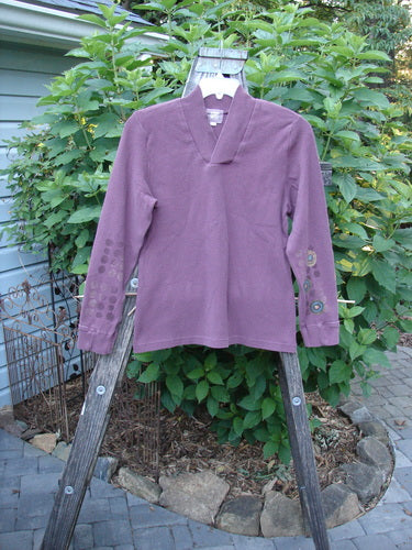 Purple 2000 Thermal Boann Top Bubble Murple Size 1 displayed on a wooden ladder, showcasing its thick ribbed V neckline, paneled tapered cuffs, and slightly tapered waist and hem.