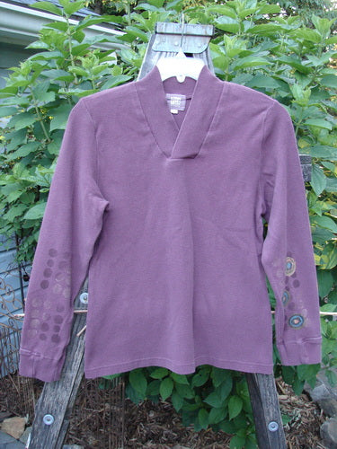 2000 Thermal Boann Top Bubble Murple Size 1 on a clothes rack, showcasing its thick ribbed V neckline, partially ribbed cuffs, and bubble-themed paint with a slightly tapered waist and hem.