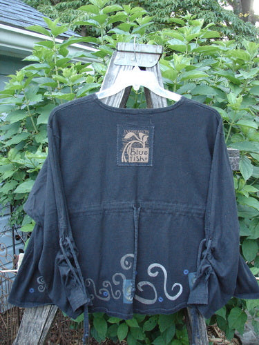 1997 Chandra Top Celtic Holiday Obsidian Size 1: black shirt with full lower sleeve lacings, rounded wide hemline, rolled neckline, Celtic holiday theme paint, drawcord back, and signature Blue Fish patch.