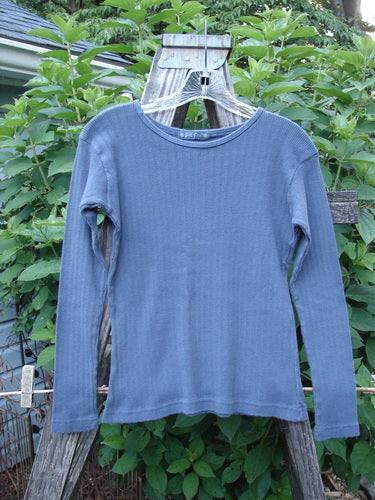 1998 Pointelle Long Sleeved Undertop Top Unpainted Orion Size 0 displayed on a clothes rack, showcasing its soft rib knit pointelle pattern and cozy, slightly longer sleeves.