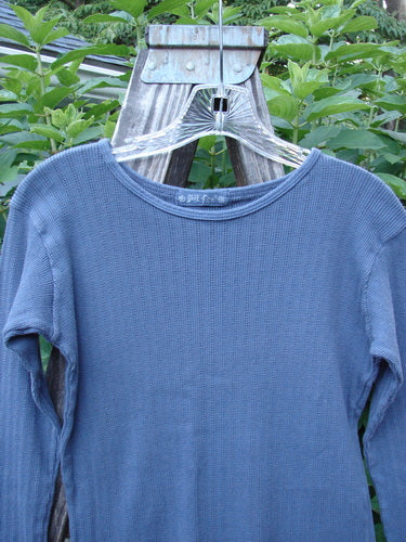 1998 Pointelle Long Sleeved Undertop Top Unpainted Orion Size 0 displayed on a clothes hanger, showcasing its soft rib knit pattern, cozy sleeves, and rolled neckline.