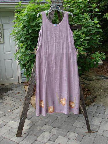 1999 Handkerchief Linen Sunbeam Dress Leaf Orchid Size 0 displayed on a wooden rack, featuring a full-length sweeping skirt, empire waist seam, and sectional panels with a sweet leaf theme.