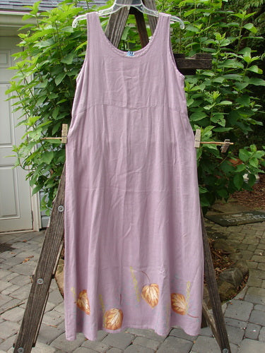 1999 Handkerchief Linen Sunbeam Dress Leaf Orchid Size 0, featuring a full-length sweeping skirt and empire waist seam, displayed on a clothesline.