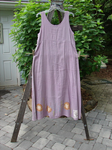 1999 Handkerchief Linen Sunbeam Dress Leaf Orchid Size 0 displayed on a wooden rack, showcasing its full-length sweeping skirt, empire waist seam, and sweet leaf theme paint pattern.