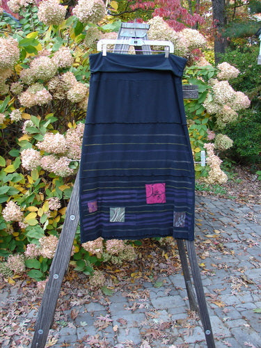 Barclay Patched Fold Over Ruffle Panel Skirt on clothes rack, with close-up of dress details.