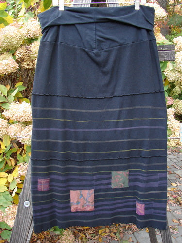 Barclay Patched Fold Over Ruffle Panel Skirt: Long black skirt with patchwork design, organic cotton thermal fabric, fold over waist panel, horizontal stitchery, tiny patches along hem panel, coordinating stripes, lettuce edge, size 2.