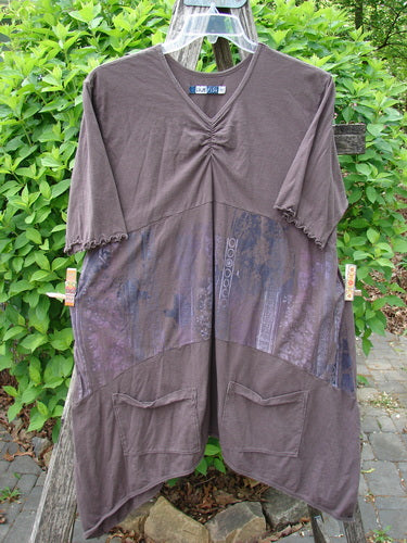 Barclay Perfect Day Pocket Tunic Dress Garden Gate Deep Woods Size 0, showcases a loose, earth-brown design with a gathered V-neck, elbow-length frilled sleeves, patch pockets, and patchwork-style panels.