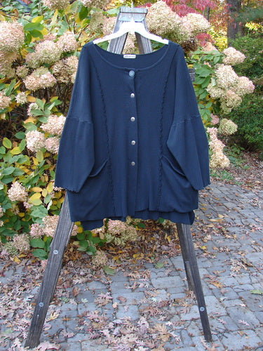 Vintage Barclay Thermal Curl Pocket Cardigan in Black, Size 3, on display. Features include Full Button Front, Dolman Sleeves, Drop Front Pockets, Shirttail Hemline, and Vertical Stitchery. Unpainted for effortless styling.