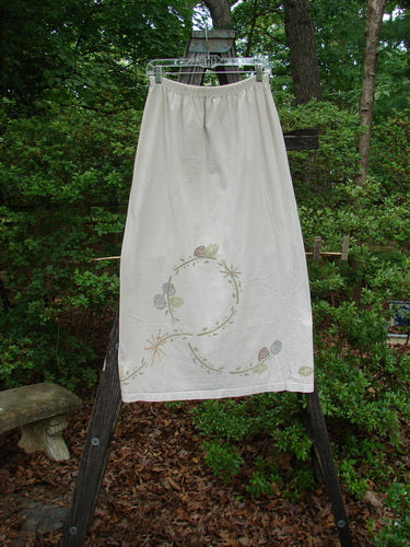 A 1995 Straight Skirt Life Circle Natural Size 1 hanging on a clothesline, showcasing its slightly flared lower hem and intricate design.
