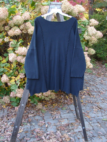 Vintage Barclay Thermal Curl Pocket Cardigan in Black, Size 3, on clothes rack. Features full button front, dolman sleeves, drop front pockets, and wider neckline. Unpainted for effortless style. From BlueFishFinder.com.