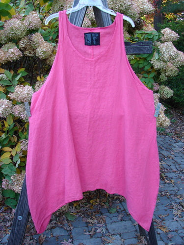 Barclay Linen Curve Drop Pinafore Dress, a pink tank top on a clothes line, with a daisy theme paint and varying hemline. Size 2.