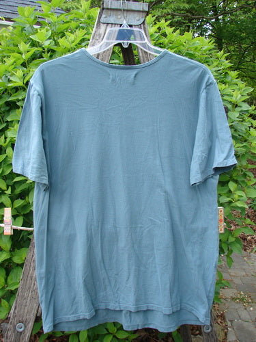 Barclay Short Sleeved Straight Tee BF Promo Light Tealen Size 0 displayed outdoors on a clear hanger, showcasing its rounded neckline, wide sleeves, and generous fit, signature of Bluefishfinder's vintage style.