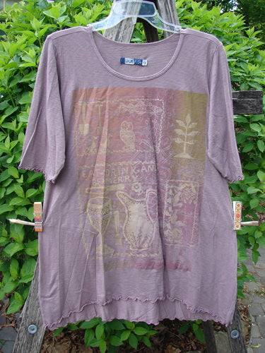 Barclay Slub Modal Three Quarter Sleeved Cafe Tee Merry Farm Mallow Size 0 features a scooped neckline, short sleeves, and scalloped edges with a faded animal and plant motif graphic.