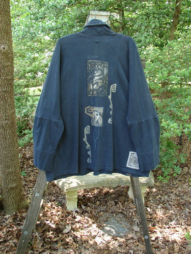 1995 Reprocessed Deco Jacket Star Rise Black OSFA displayed on a wooden stand, showcasing its drop dolman shoulders, oversized front pockets, and unique double buttonhole closure.