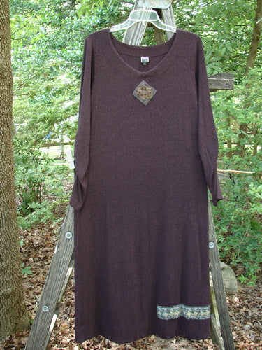 2000 Patched Rayon Lycra Rib Julia Dress Cassis Heather Size 0 displayed flowing on a wooden ladder, showcasing its sectional front crisscross and gathered forearms.