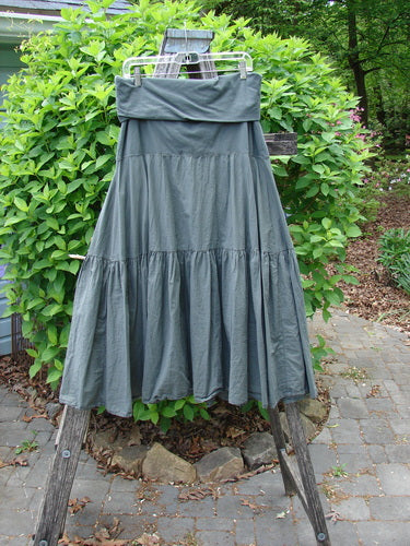 Barclay NWT Batiste Fold Over Silhouette Skirt Unpainted Chimera Size 1, showcased on a wooden stepladder outdoors, highlights its tiered design and soft waistline, embodying Bluefishfinder.com's vintage aesthetic.