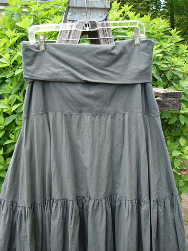 Barclay NWT Batiste Fold Over Silhouette Skirt Unpainted Chimera Size 1, displayed outdoors, showcasing its tiered, flowing A-line design and soft waistline, highlighting Bluefishfinder.com's vintage-inspired, creative fashion.
